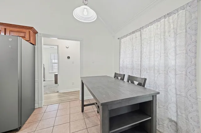 a kitchen with a table and chairs