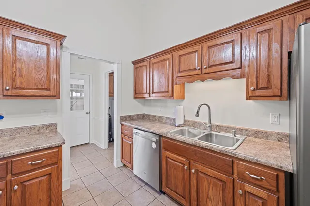 a kitchen with stainless steel appliances granite countertop a sink stove and cabinets