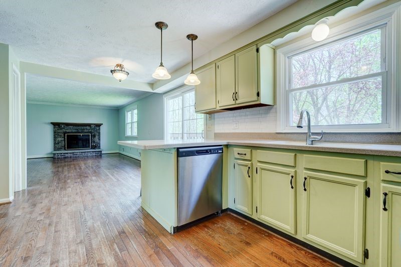 44 Latchmere Drive Victor, NY 14564 - Photo 15 of 50 KITCHEN SINK VIEW TO THE REAR YARD AND MULTIPLE FA