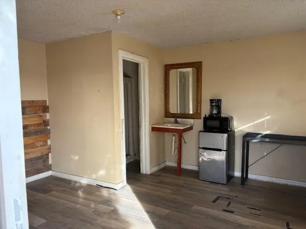 a view of kitchen and wooden floor