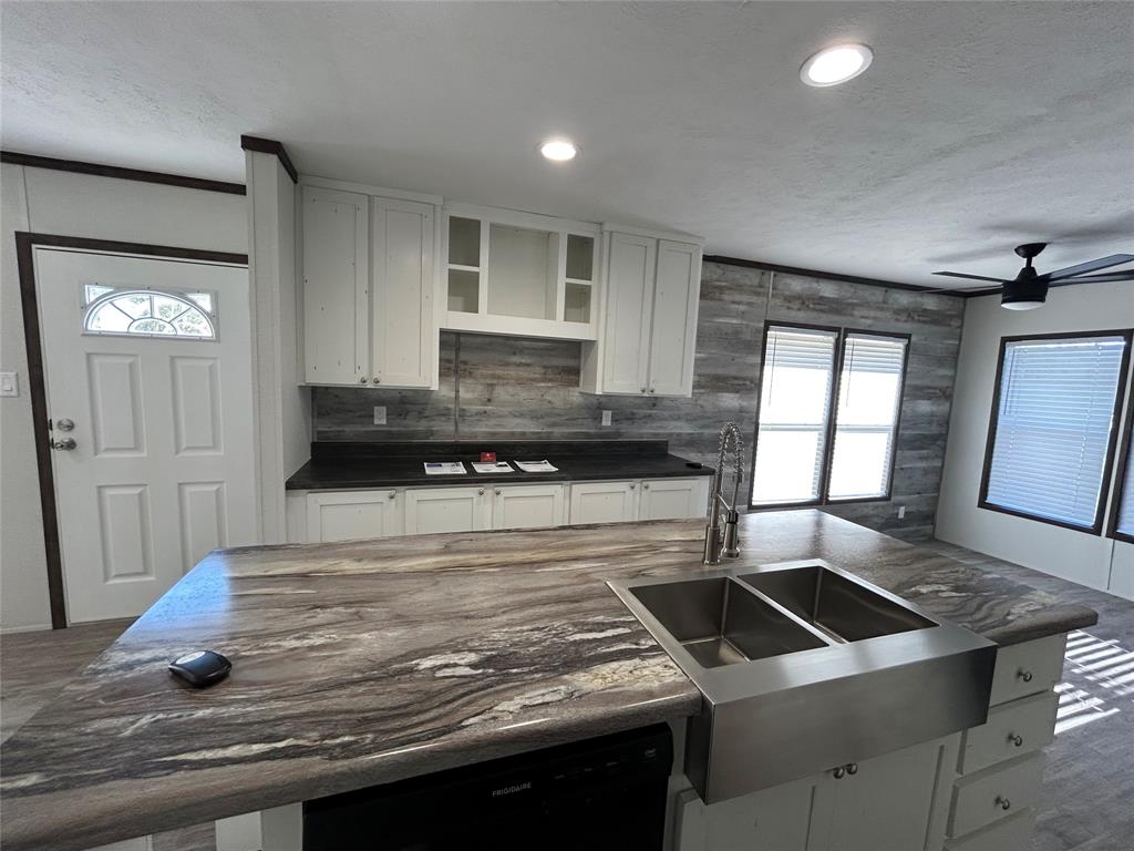 439 Whitefoot Quitman, TX 75783 - Photo 11 of 35 a kitchen with a stove and a sink