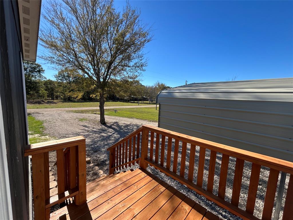 439 Whitefoot Quitman, TX 75783 - Photo 12 of 35 a view of a deck with a yard