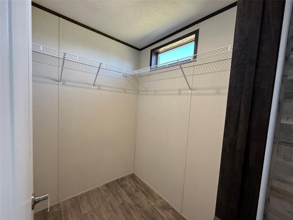 439 Whitefoot Quitman, TX 75783 - Photo 14 of 35 a view of a room with racks on the wall