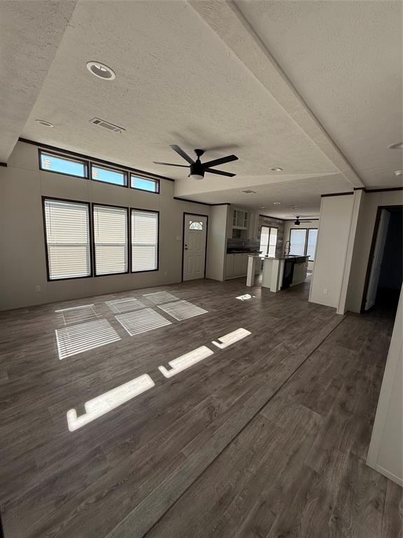439 Whitefoot Quitman, TX 75783 - Photo 25 of 35 a view of empty room with wooden floor and fan