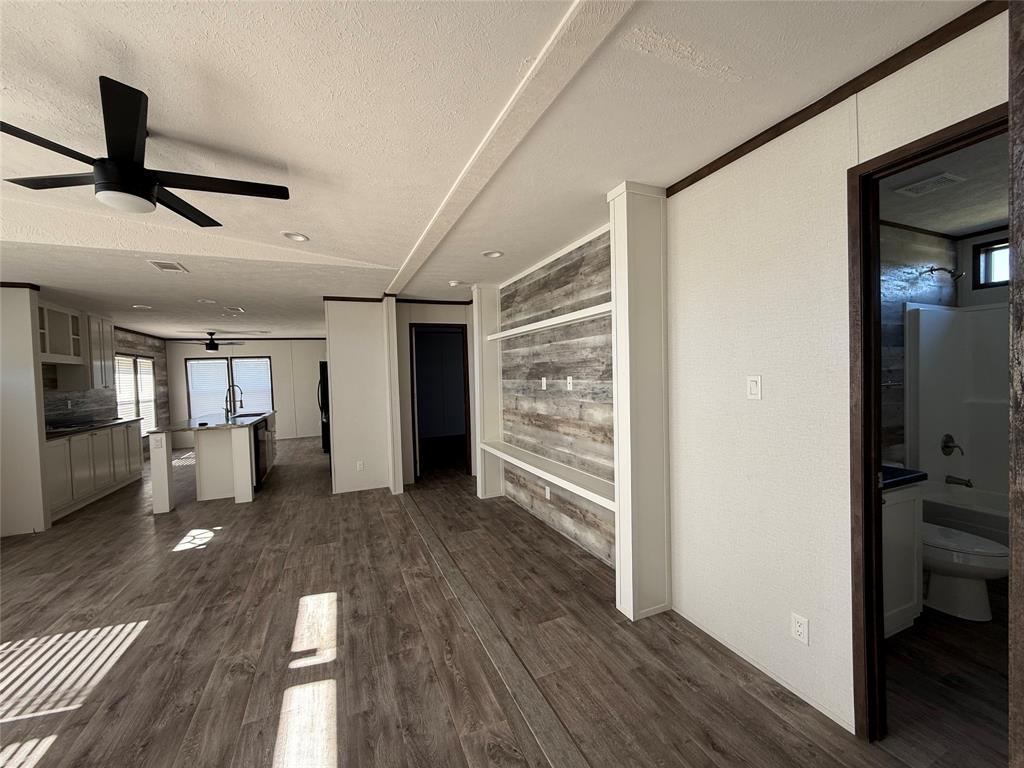 439 Whitefoot Quitman, TX 75783 - Photo 26 of 35 a view of empty room with wooden floor and fan