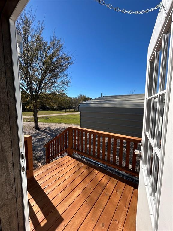 439 Whitefoot Quitman, TX 75783 - Photo 30 of 35 a view of balcony with wooden floor and fence