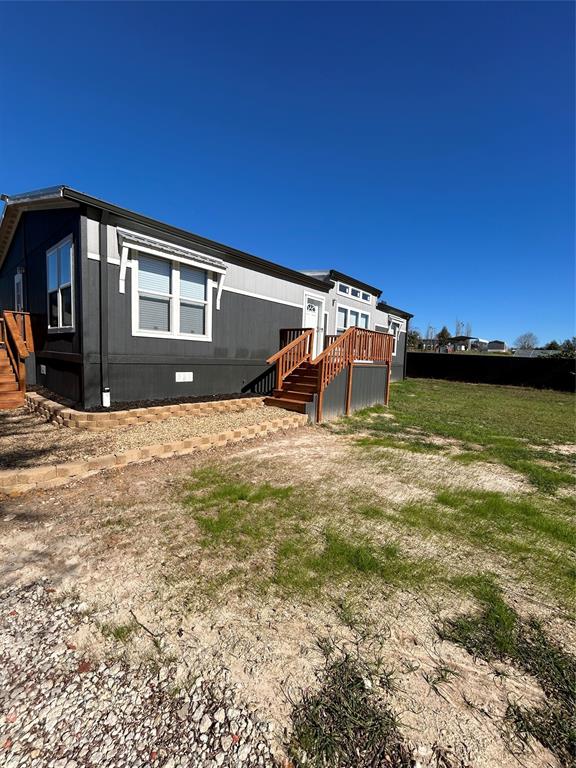 439 Whitefoot Quitman, TX 75783 - Photo 3 of 35 a view of a house with a yard