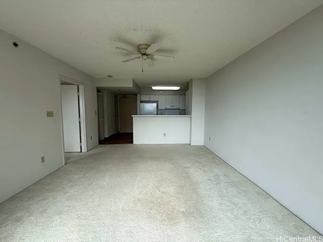 a view of a big room with a kitchen