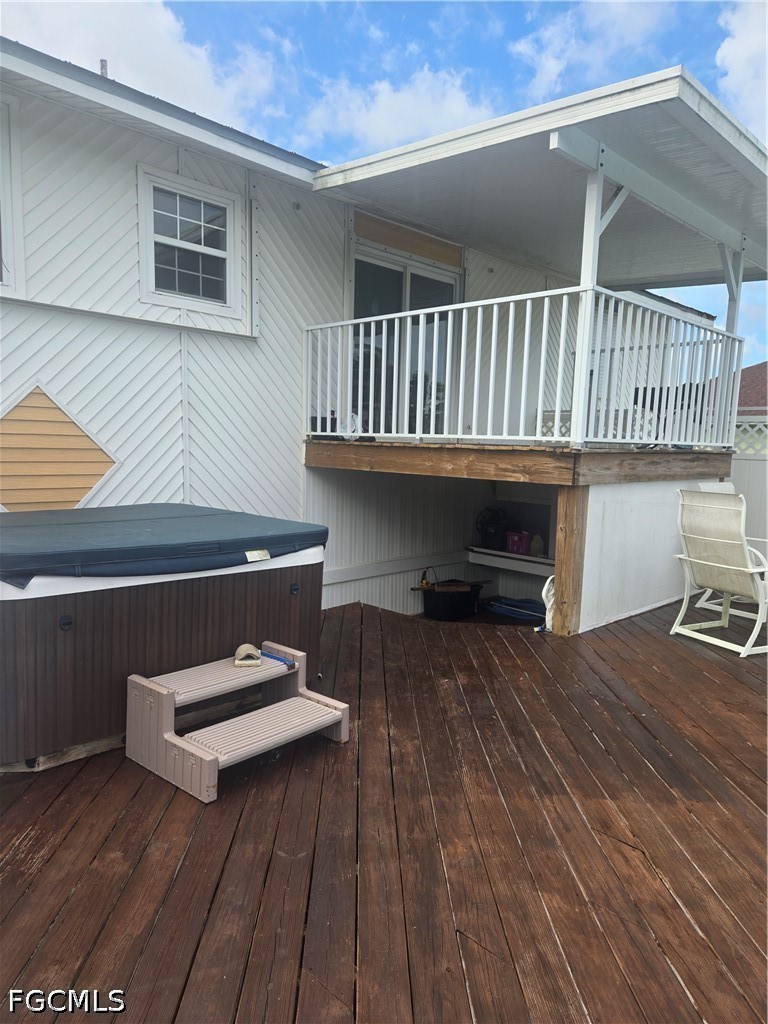 8093 Anhinga Road Fort Myers, FL 33967 - Photo 43 of 49 a view of outdoor space with deck and flat screen tv
