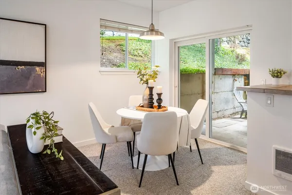 a dining room with furniture and window