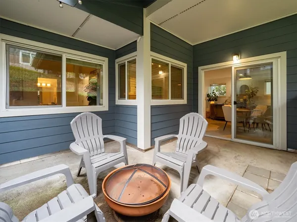a view of a patio with a table and chairs