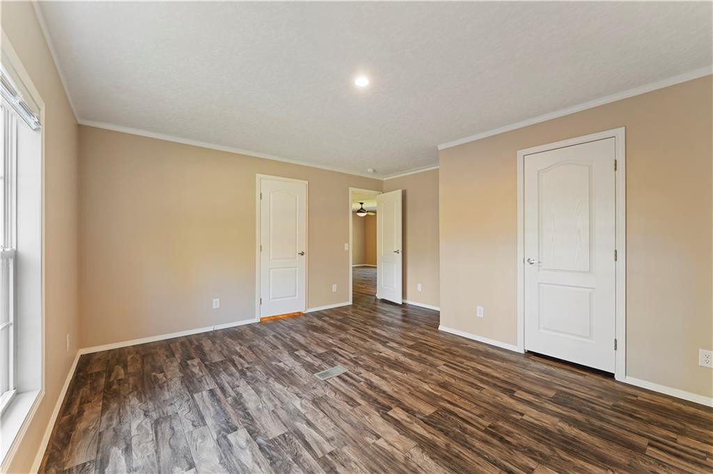 89 Ridge Road Seale, AL 36875 - Photo 32 of 46 Recessed lighting, wood-finish flooring, neutral-toned walls, and white trim