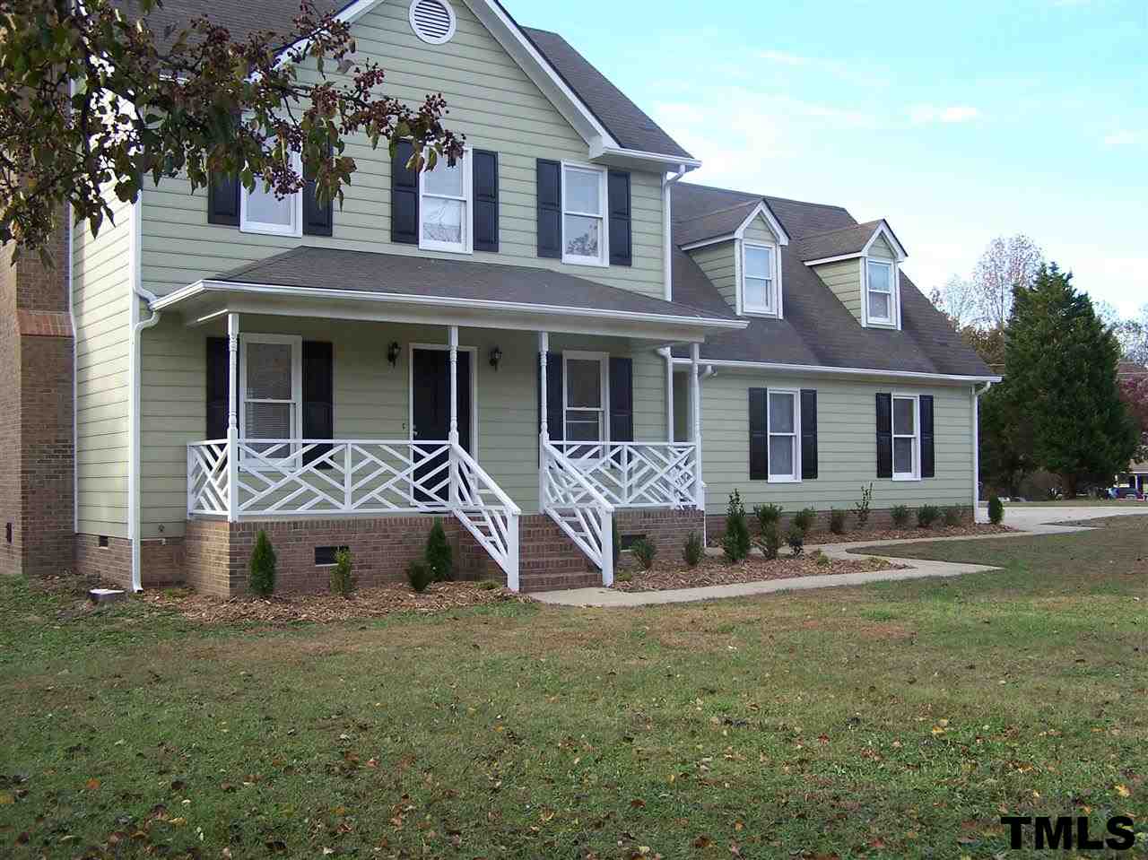17 Sanders Road Benson, NC 27504 - Photo 1 of 18 a front view of a house with garden