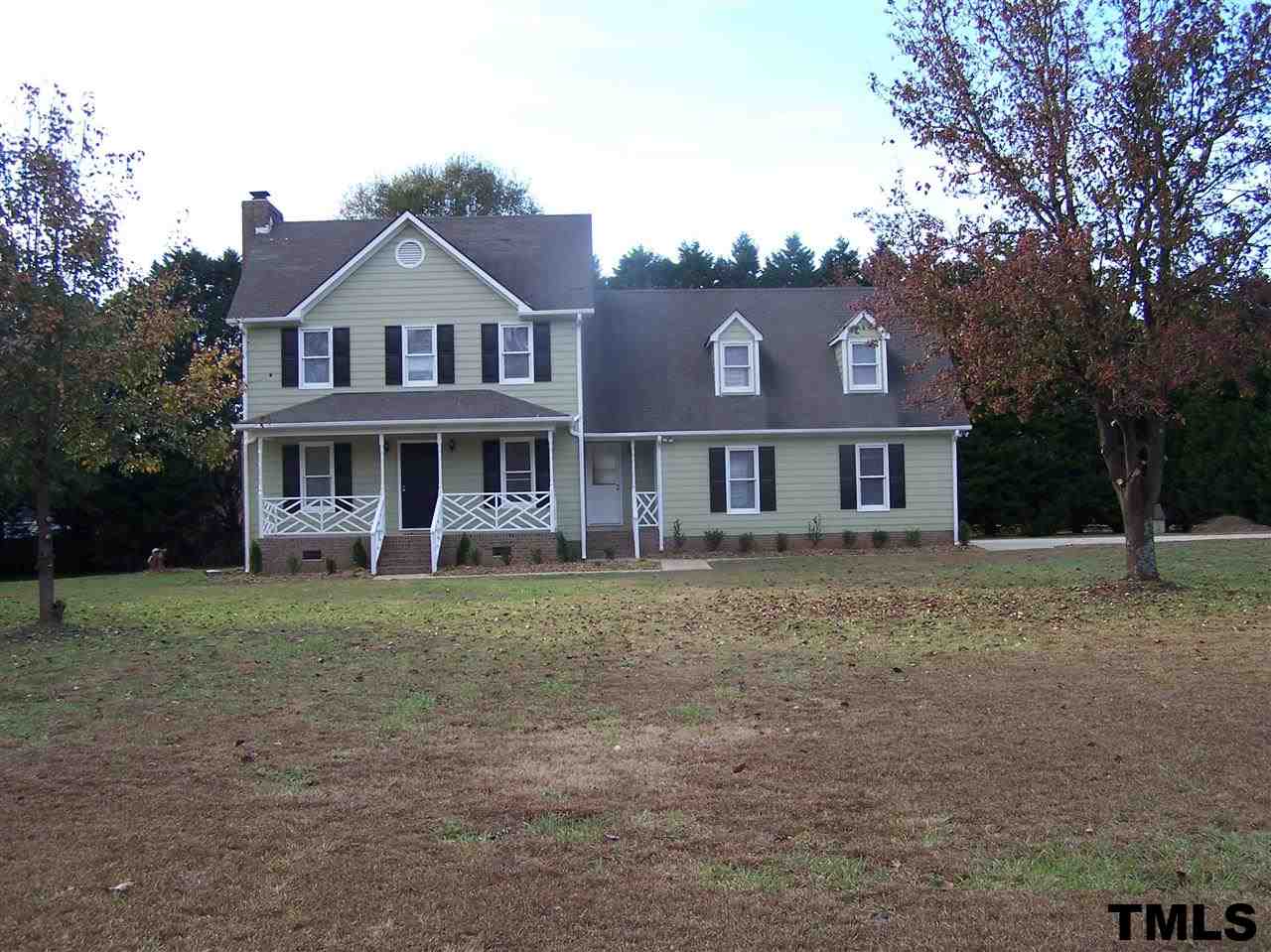 17 Sanders Road Benson, NC 27504 - Photo 18 of 18 a front view of a house with a yard