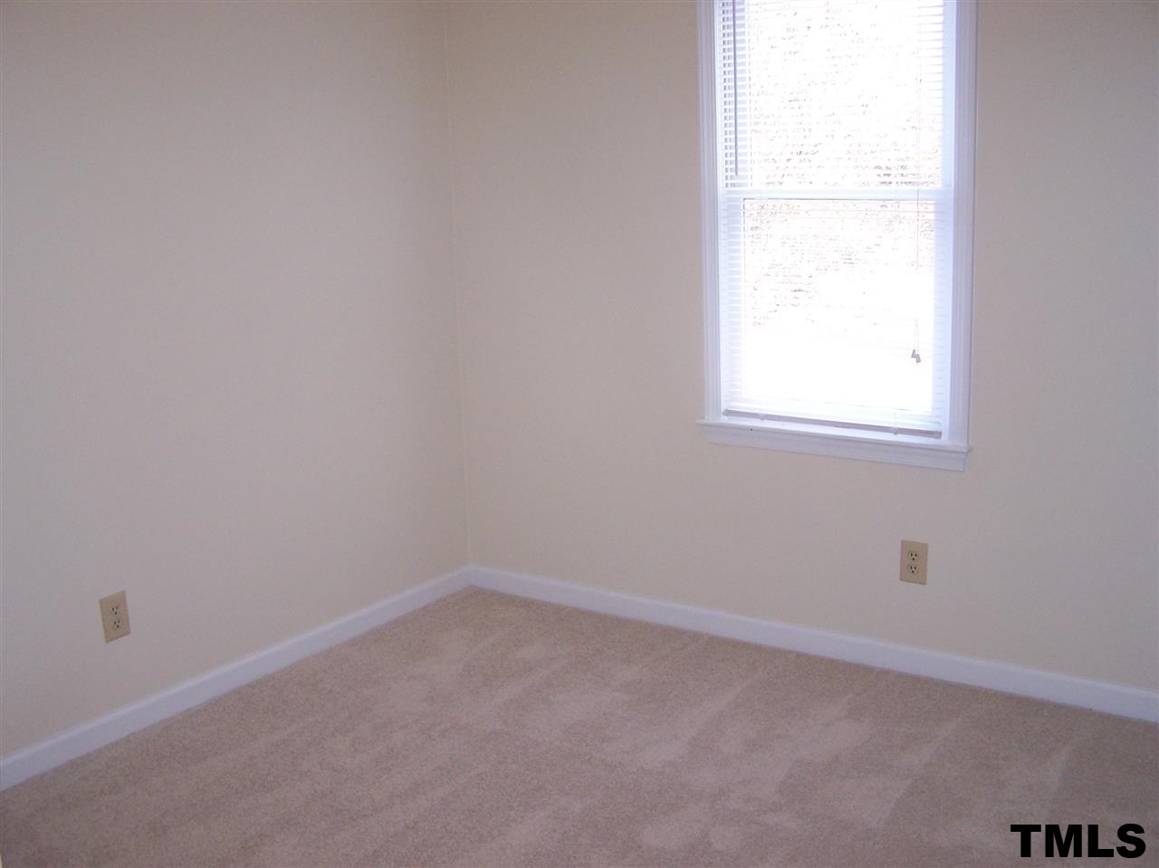 17 Sanders Road Benson, NC 27504 - Photo 8 of 18 an empty room with a window
