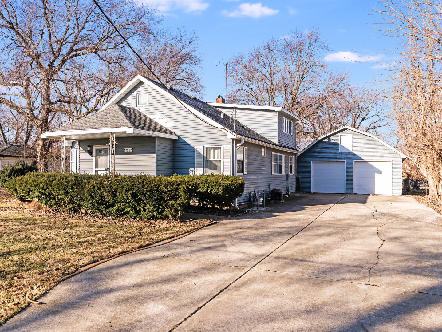 17902 Locust Street Lansing, IL 60438 - Photo 1 of 15 a front view of a house with a yard
