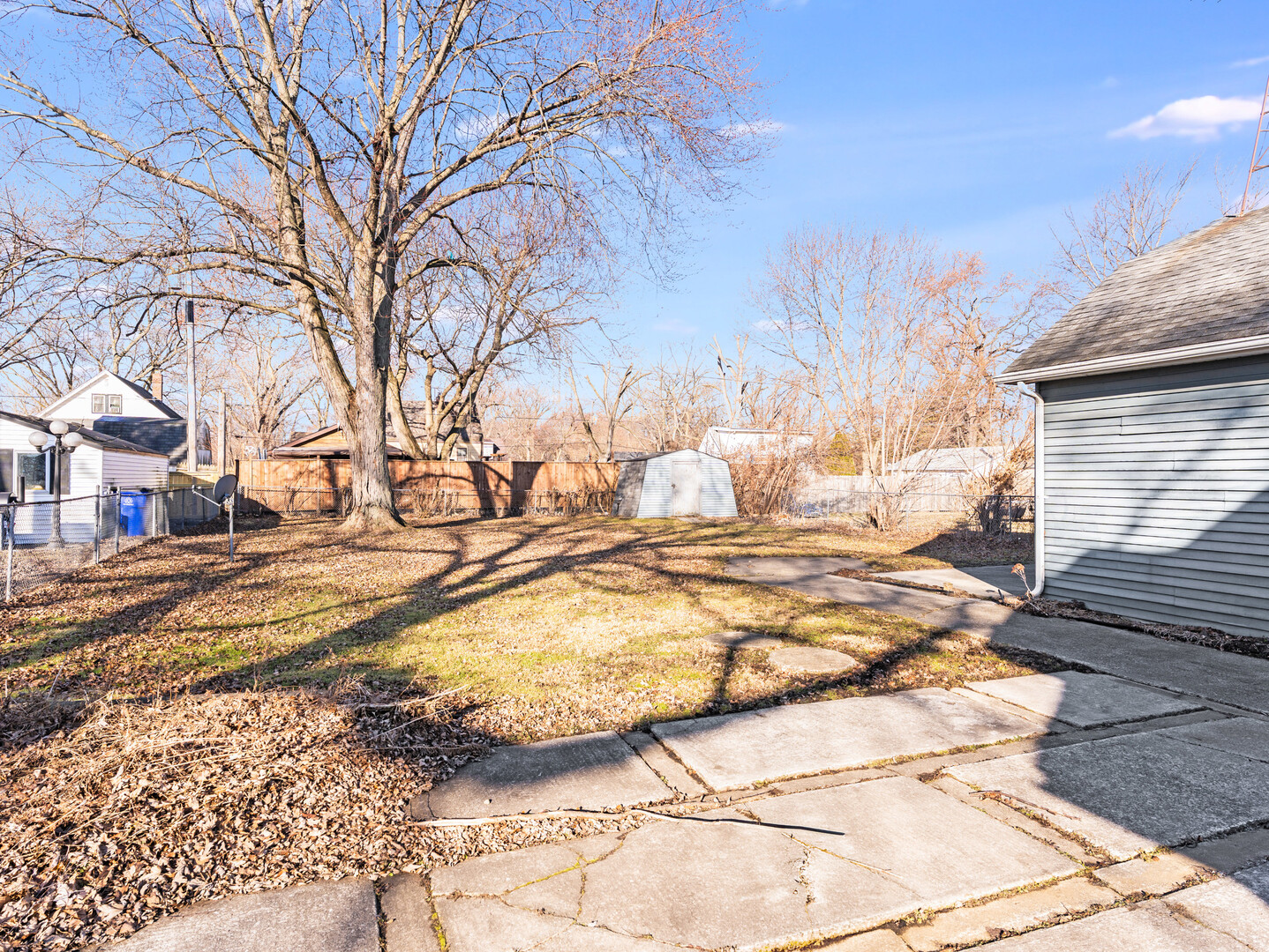 17902 Locust Street Lansing, IL 60438 - Photo 4 of 15 a view of yard covered with snow in the background