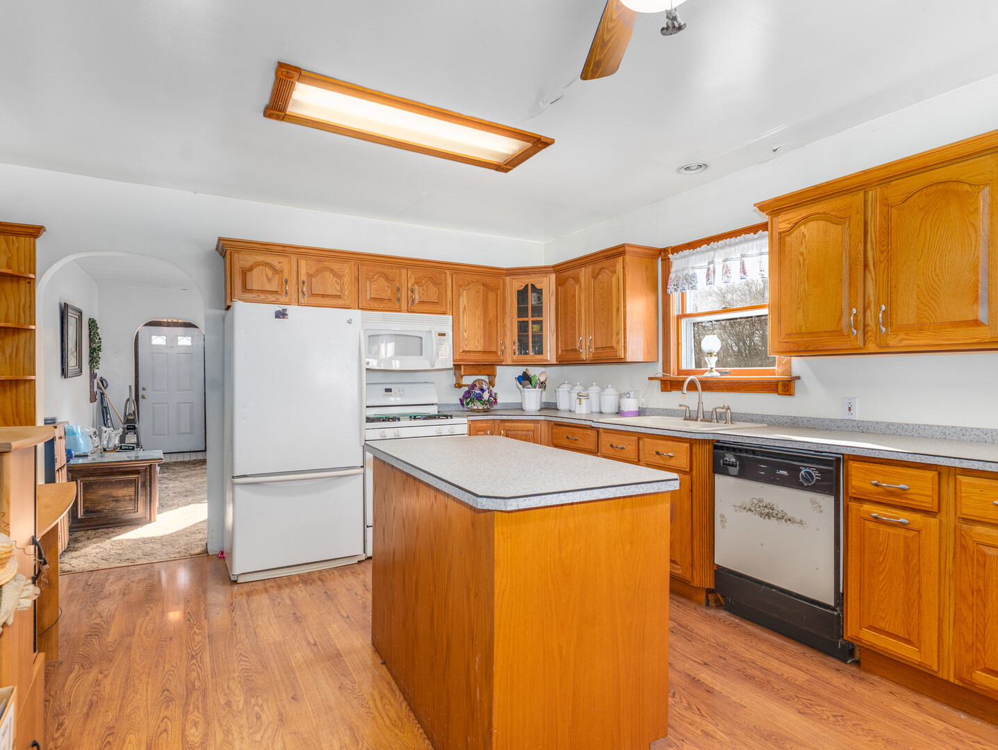 17902 Locust Street Lansing, IL 60438 - Photo 8 of 15 a kitchen with stainless steel appliances granite countertop a sink stove and refrigerator
