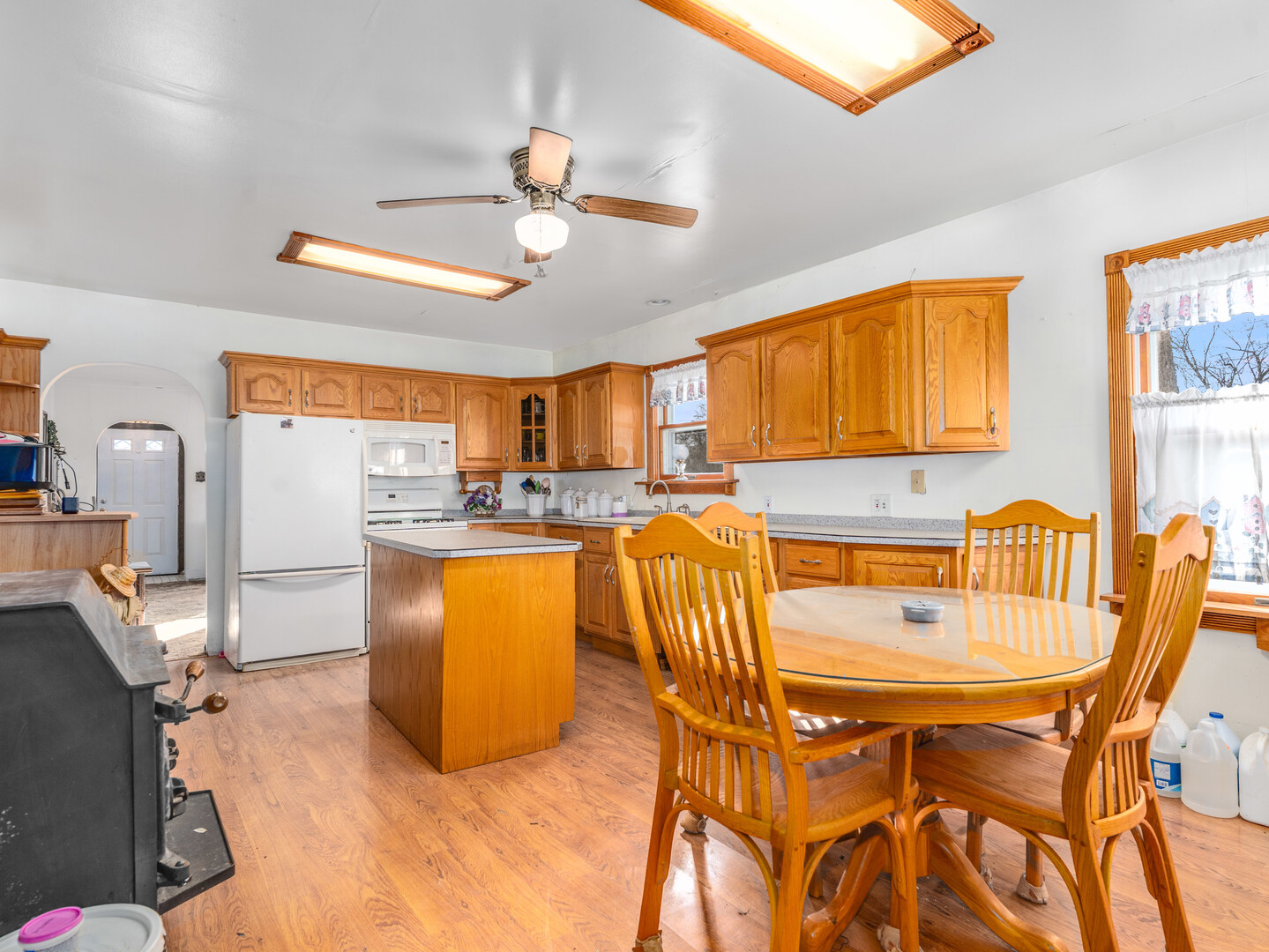 17902 Locust Street Lansing, IL 60438 - Photo 10 of 15 a dining room with furniture a window and kitchen view