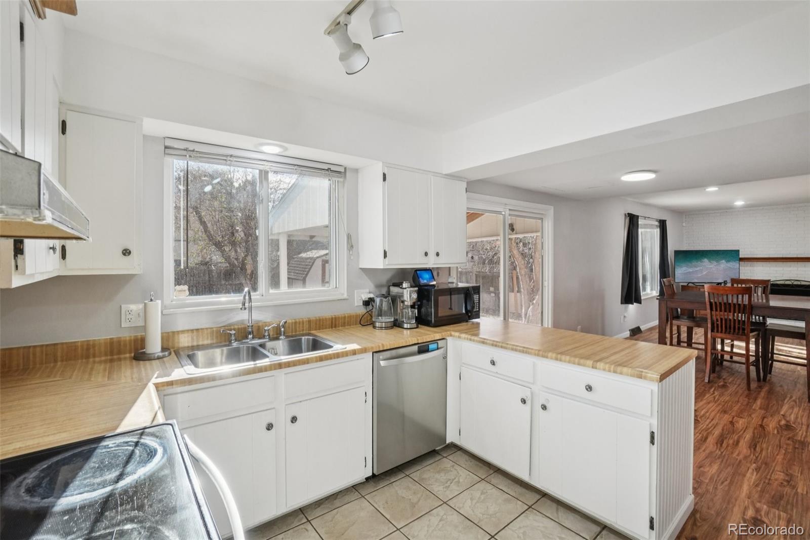 16646 East Rice Circle Aurora, CO 80015 - Photo 14 of 39 a kitchen with a sink stove and cabinets