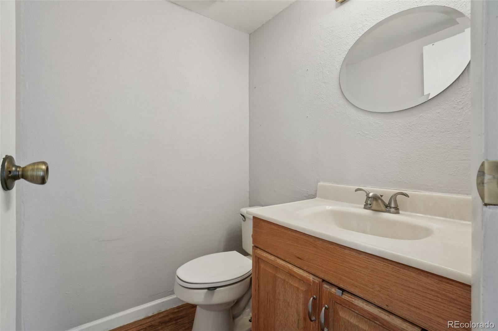 16646 East Rice Circle Aurora, CO 80015 - Photo 15 of 39 a bathroom with a sink and a mirror