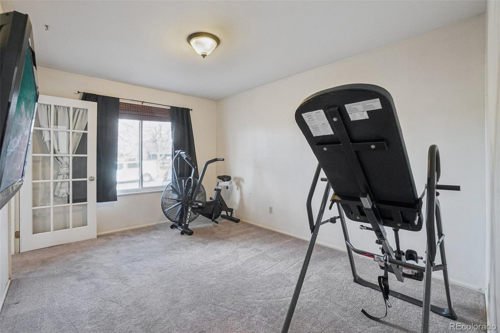 16646 East Rice Circle Aurora, CO 80015 - Photo 17 of 39 a view of a room with gym equipment