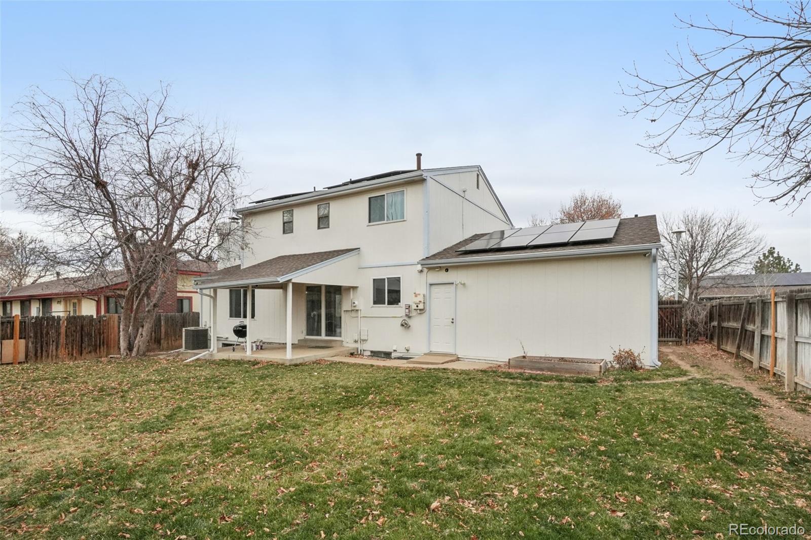 16646 East Rice Circle Aurora, CO 80015 - Photo 29 of 39 a front view of a house with a yard