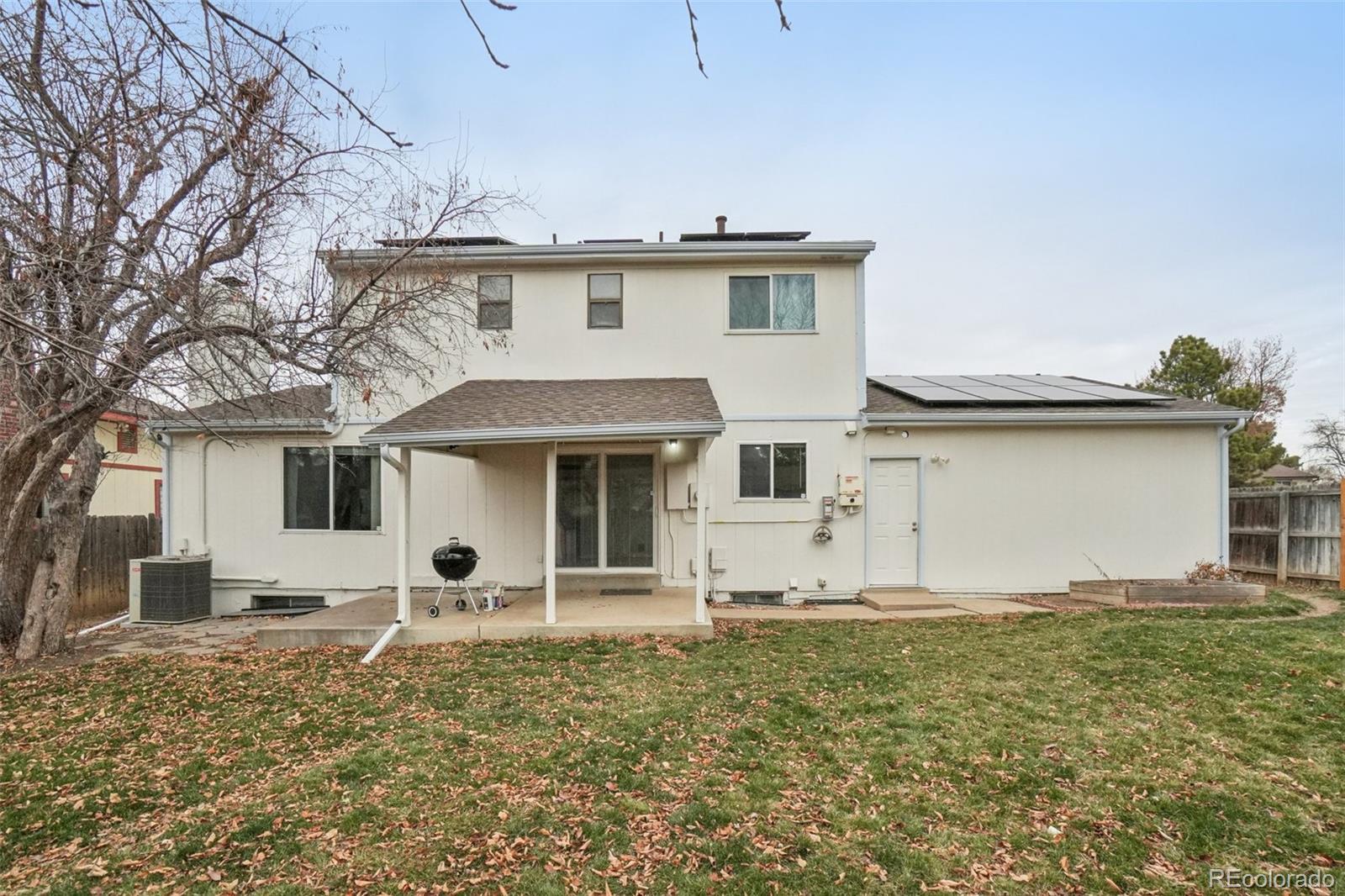 16646 East Rice Circle Aurora, CO 80015 - Photo 30 of 39 a front view of a house with garden