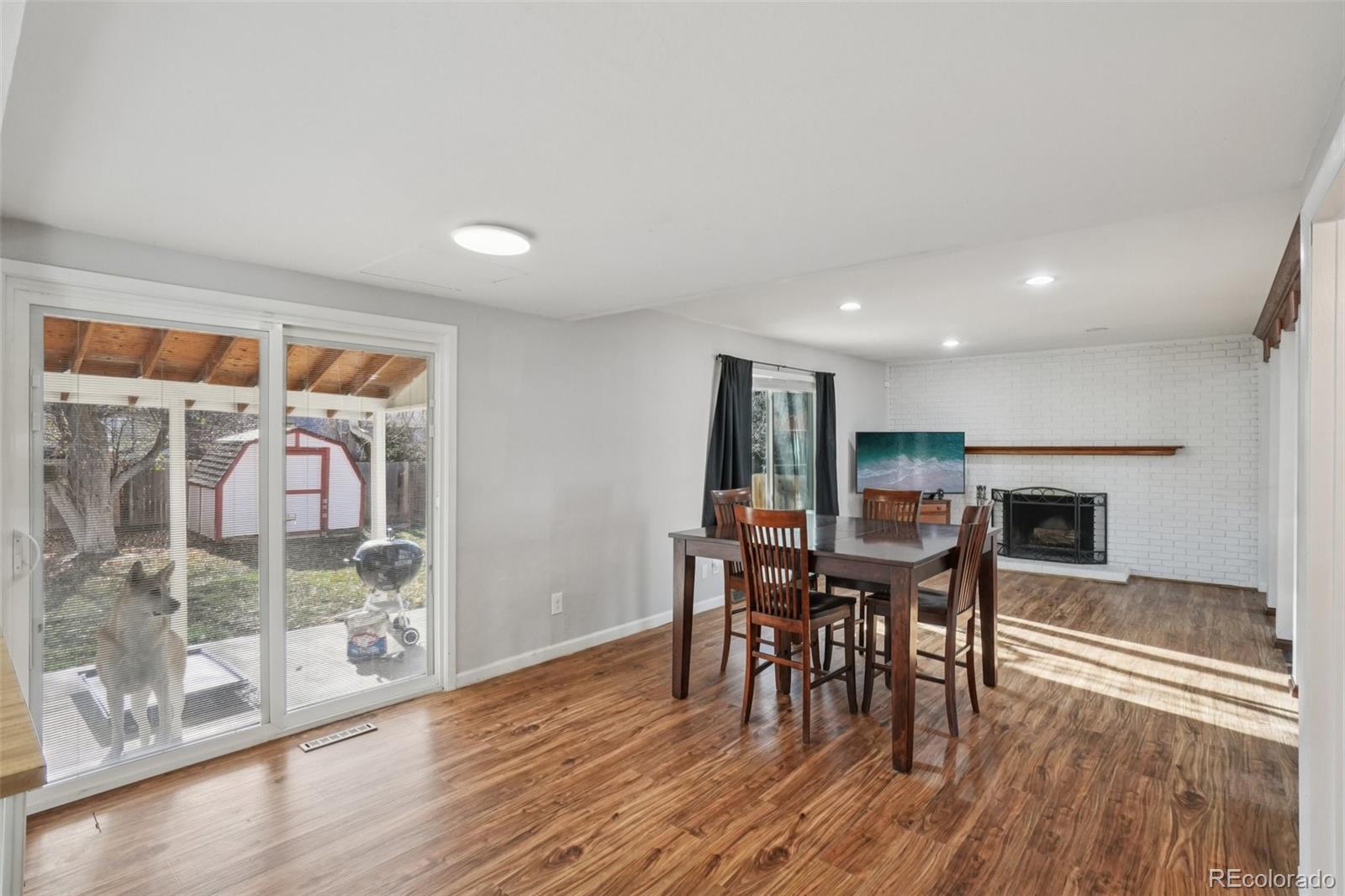 16646 East Rice Circle Aurora, CO 80015 - Photo 10 of 39 a dining room with furniture and wooden floor