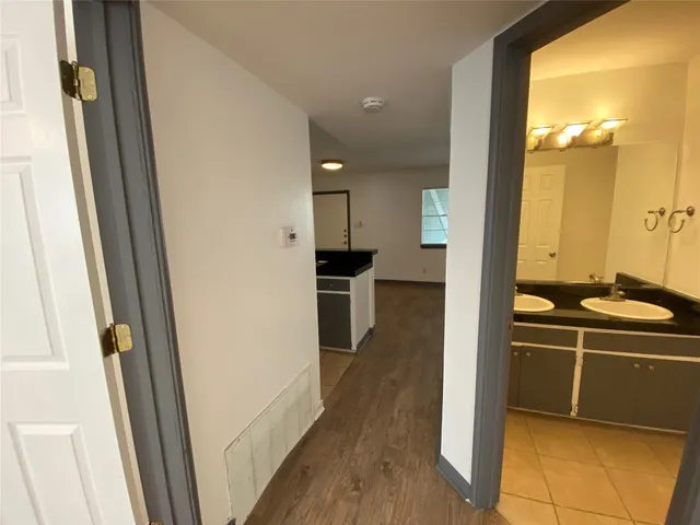 a view of a bathroom from a hallway