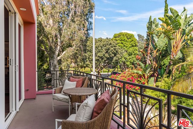 a balcony with chairs
