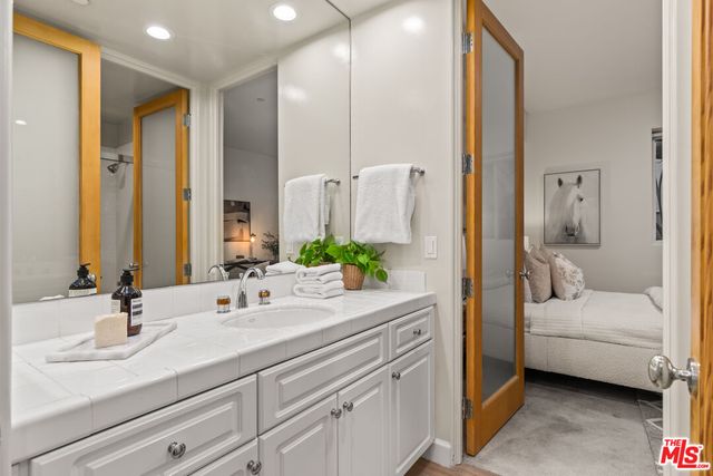 a bathroom with a sink and a mirror