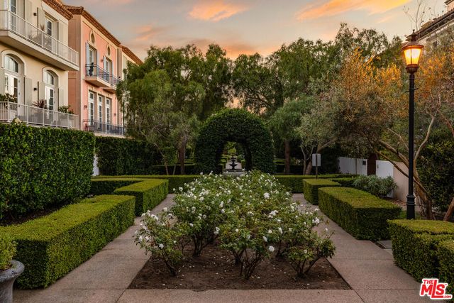 a garden view with a fountain