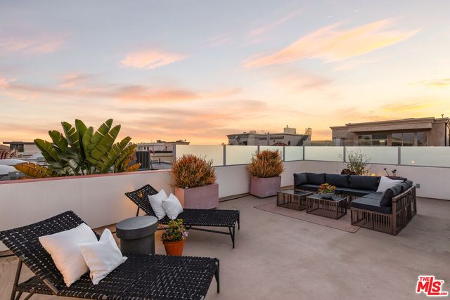 a view of a terrace with furniture