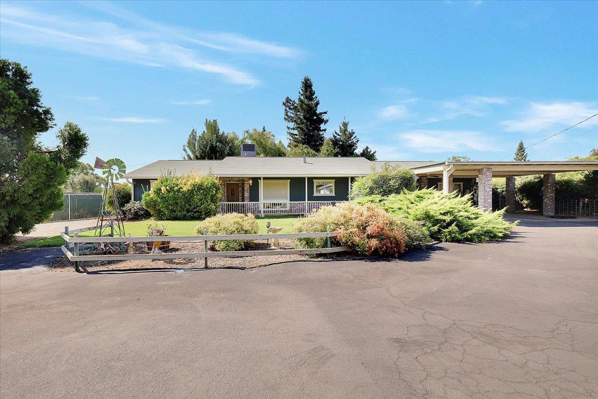 front view of a house with a garden