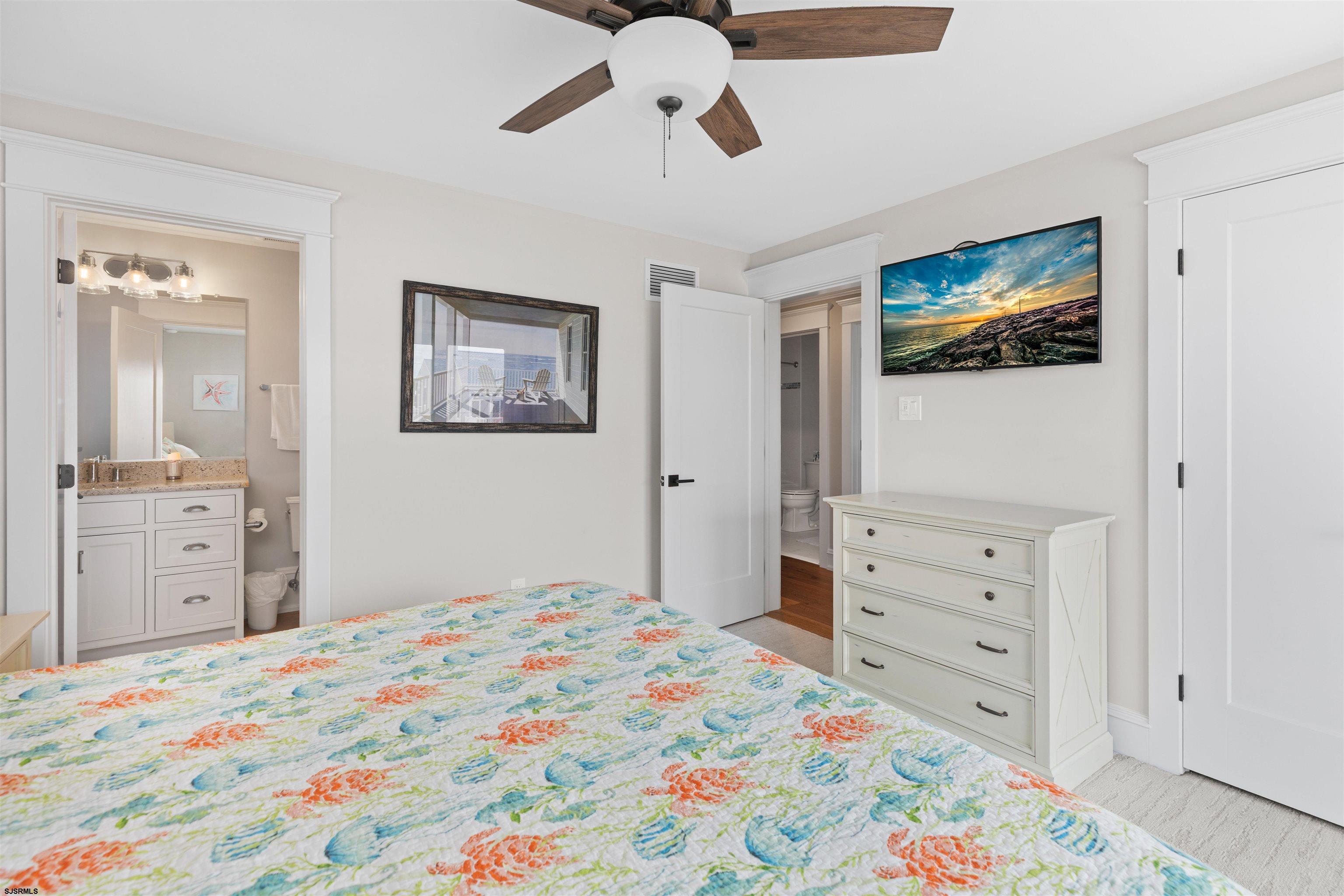 3913 Central Avenue, Unit A Ocean City, NJ 08226 - Photo 14 of 31 a bedroom with a bed and a dresser in it