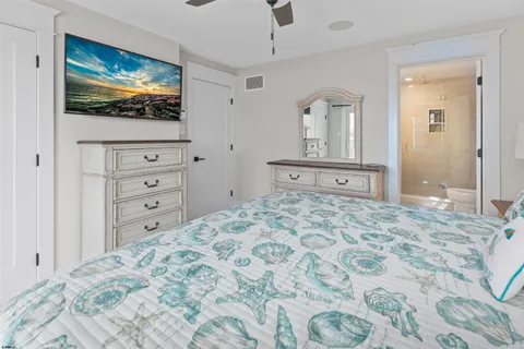 a bathroom with a double vanity sink mirror double shower and a toilet