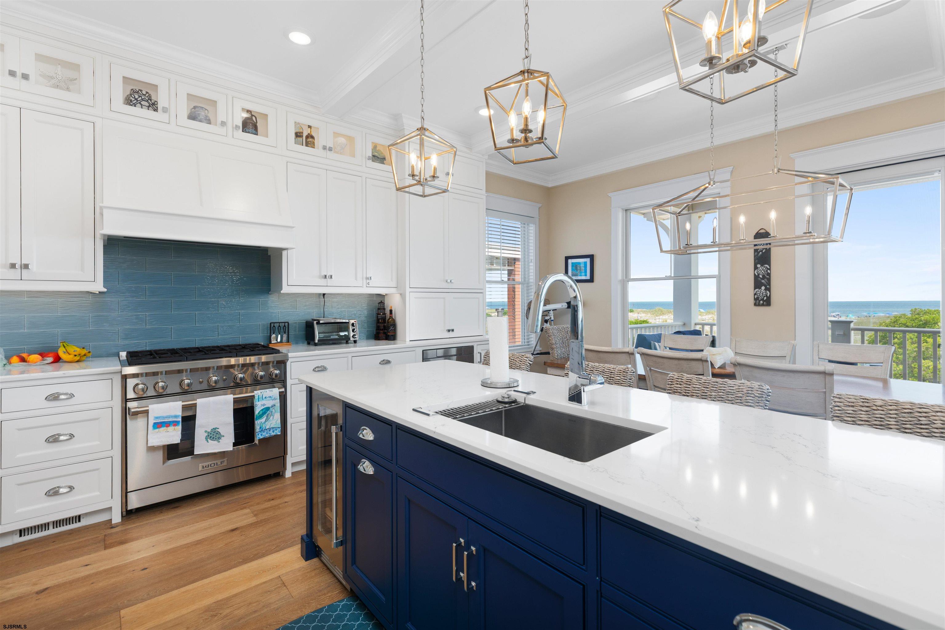 3913 Central Avenue, Unit A Ocean City, NJ 08226 - Photo 8 of 31 a large kitchen with stainless steel appliances granite countertop a lot of counter space and wooden floor