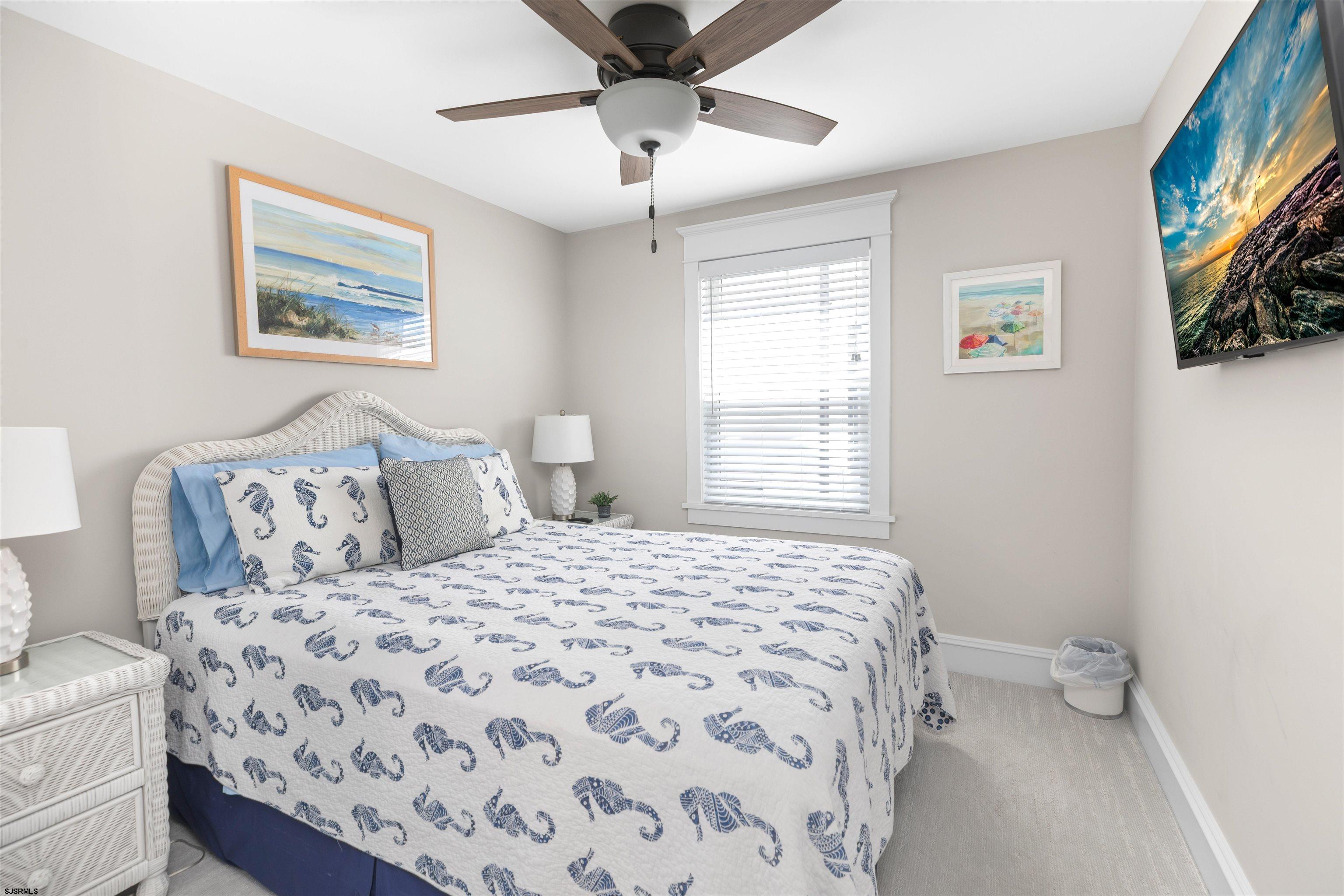 3913 Central Avenue, Unit A Ocean City, NJ 08226 - Photo 10 of 31 a bedroom with a bed and a window