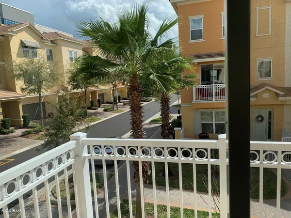 a couple of cars parked in front of a building