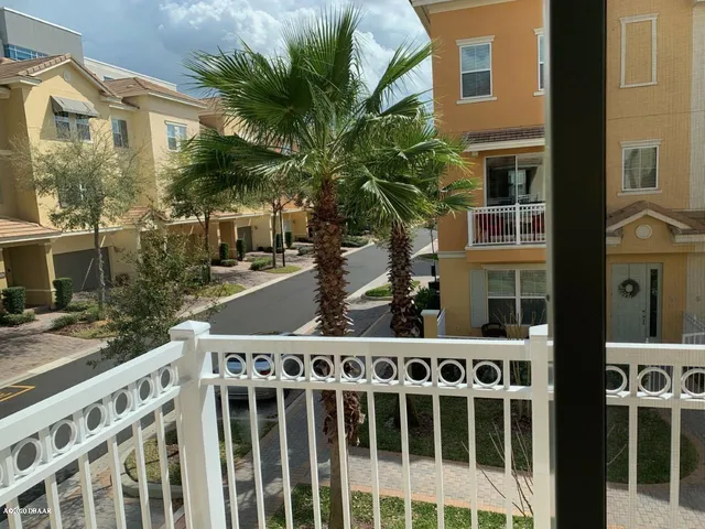 a couple of cars parked in front of a building