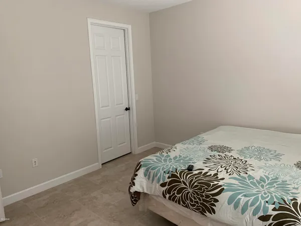 a bedroom with a bed