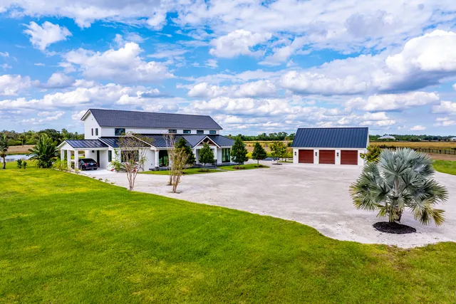 a view of a swimming pool with a yard