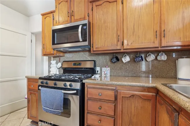 a workspace room with wooden floor and windows