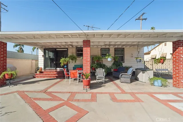 a view of a house with swimming pool and a yard