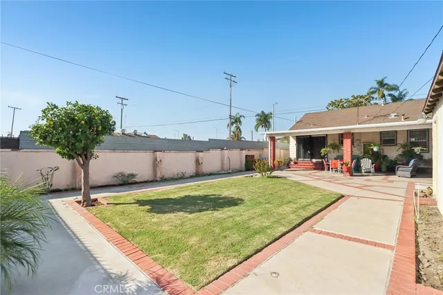 a view of a house with backyard porch and furniture