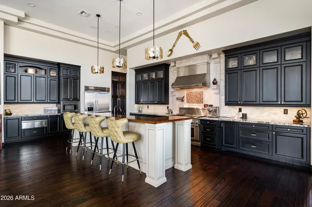 a bathroom with a granite countertop toilet sink and shower