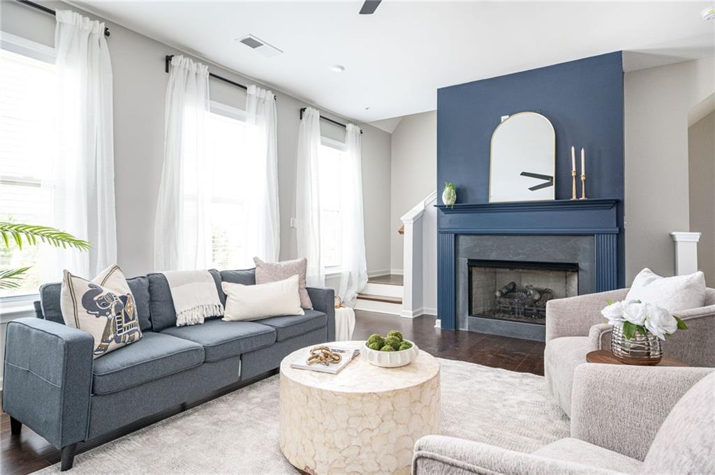 1444 Ridgebend Way Southeast Mableton, GA 30126 - Photo 19 of 34 a living room with furniture and a fireplace