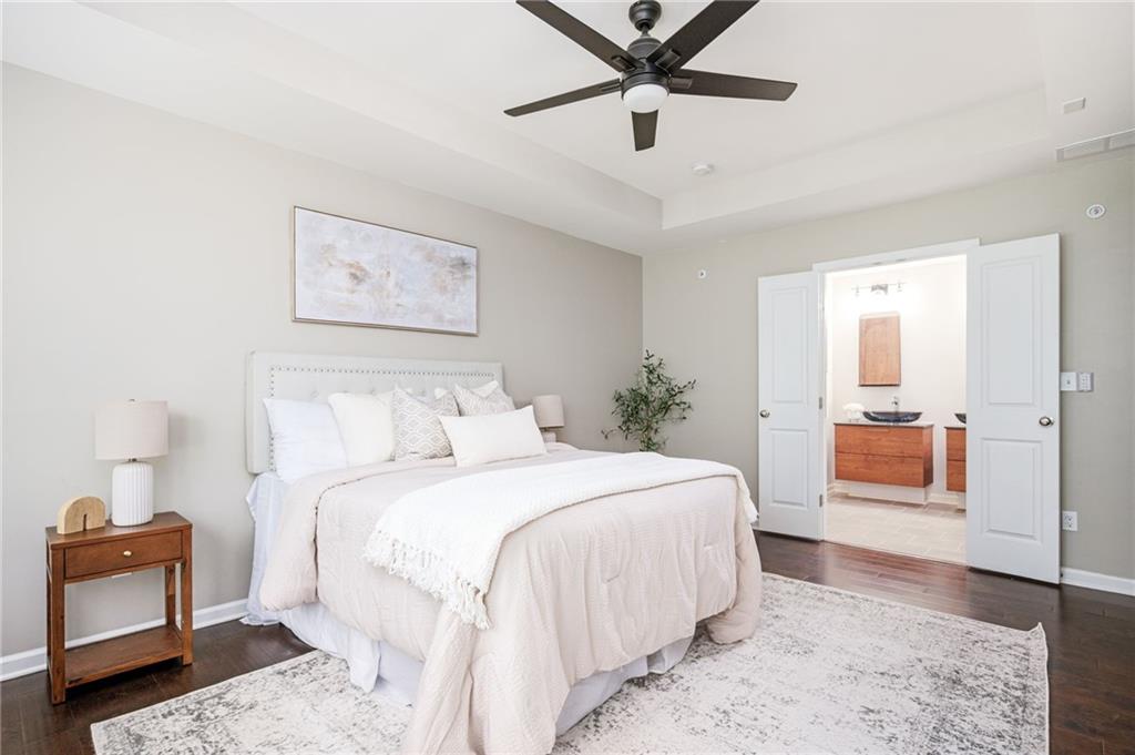 1444 Ridgebend Way Southeast Mableton, GA 30126 - Photo 22 of 34 a bedroom with a bed and a painting on the wall