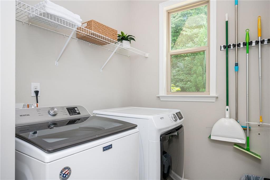 1444 Ridgebend Way Southeast Mableton, GA 30126 - Photo 30 of 34 a utility room with dryer and washer